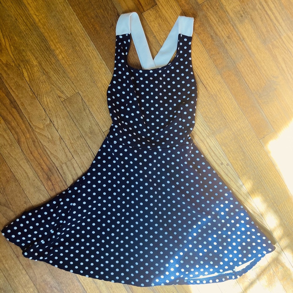 Small black polka dot, cross back mini dress.